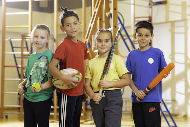 Pupils with sports equipment