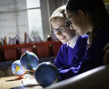 Pupils looking at globes