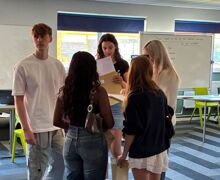 EEHS Year 13 results day 2 (group of students reading results)